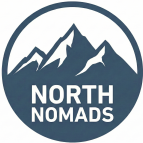 Circular North Nomads tour agency logo featuring a white snow-capped mountain silhouette on a navy blue background
