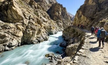 Fast flowing turquoise glacial river cutting through a rocky gorge on the Nangma Valley trekking trail, Hushe Skardu northern Pakistan
