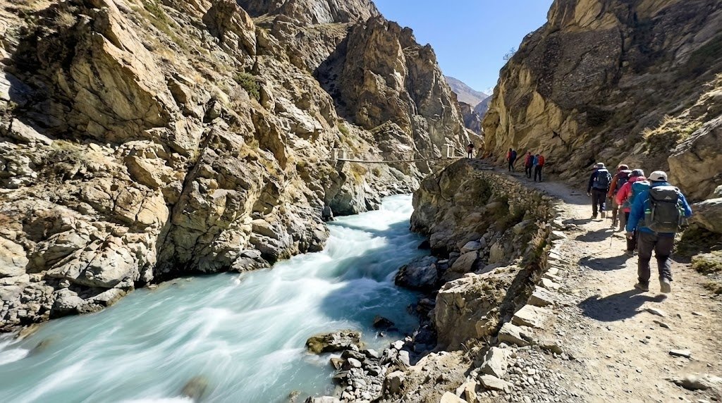 Fast flowing turquoise glacial river cutting through a rocky gorge on the Nangma Valley trekking trail, Hushe Skardu northern Pakistan