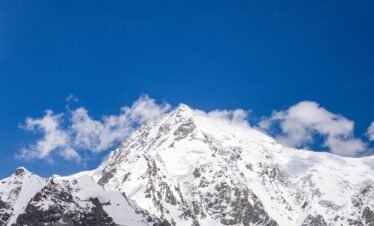 Close-up of Nanga Parbat summit at 8,126m, the world's ninth highest mountain, against a deep blue sky, Fairy Meadows