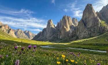 Panoramic view of Nangma Valley Pakistan, dramatic vertical granite towers rising above lush green wildflower meadows, Karakoram Skardu