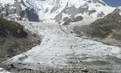 Rakaposhi glacier flowing beneath the 7,788m summit under a deep blue sky, Rakaposhi Base Camp trek northern Pakistan