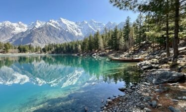 Crystal clear turquoise waters of Upper Kachura Lake reflecting snow-capped Karakoram peaks, Skardu northern Pakistan